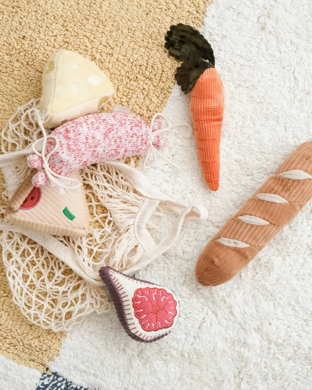 Set of plush dog toy vegetables on a textured surface