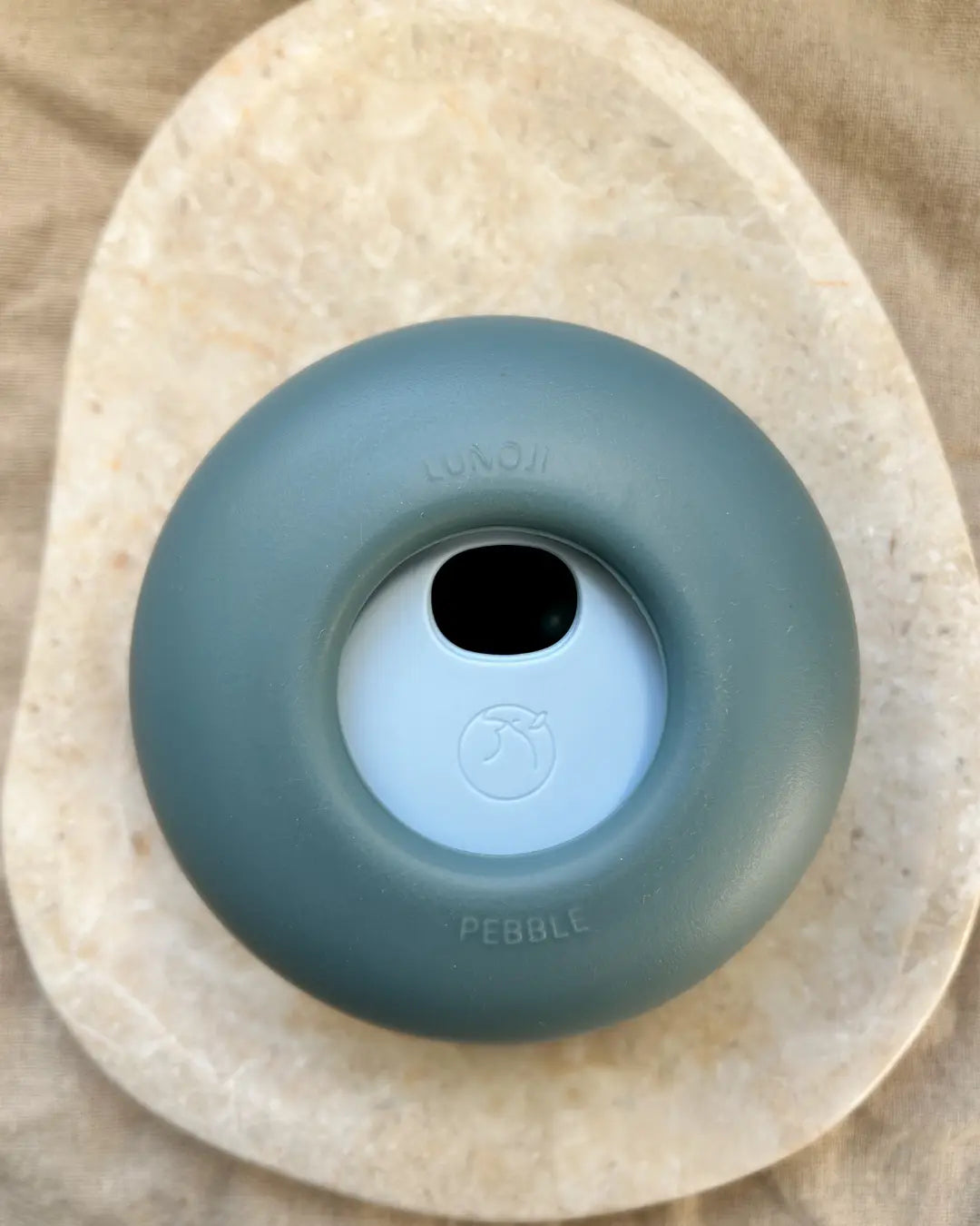 Dark and light blue Lunoji pebble dog enrichment treat dispenser